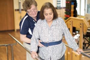 Therapist helping resident at Midtown Oaks Rehab gym