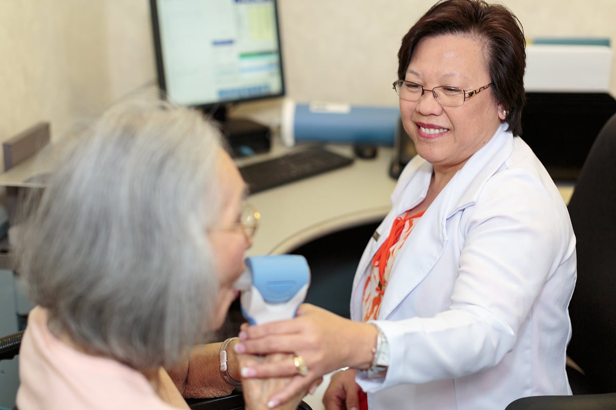 Smiling Nurse with Resident at Midtown Oaks